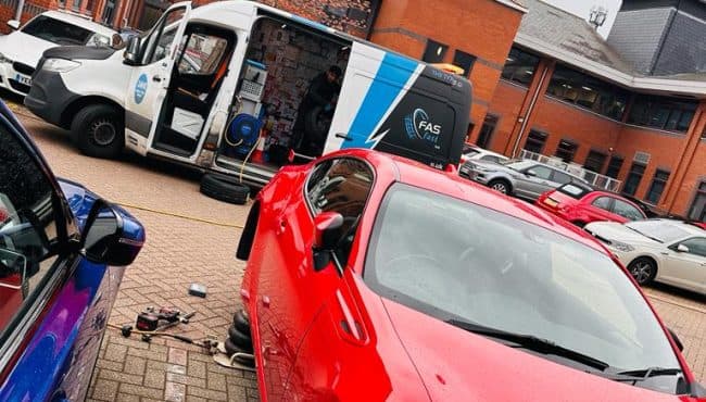   Fast Tyre fitting technician with equipment