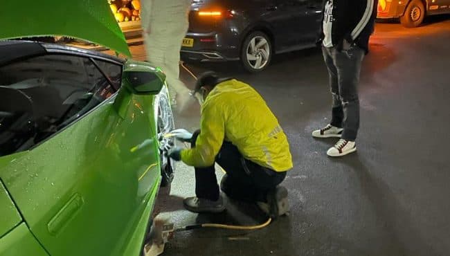   Fast Tyre fitting for sports car at night