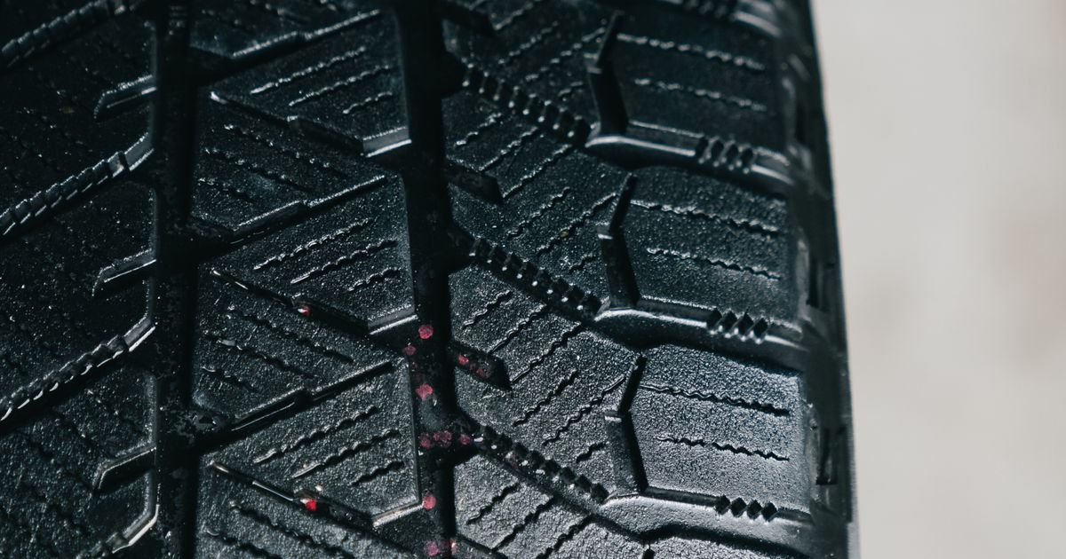 Close-up of a new tyre showing deep, legal tread depth