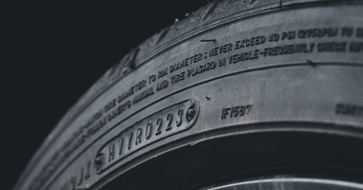 Worn tyre showing an uneven wear pattern across the tread