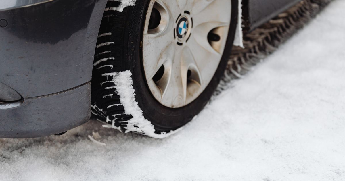 Car driving on a UK motorway, illustrating the tyre safety checks needed before sustained high-speed travel