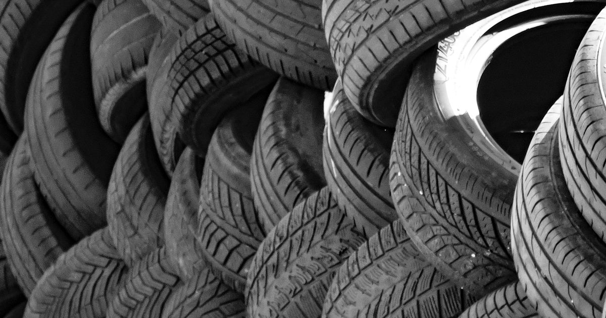 Tyre being inspected for a puncture, illustrating pre-fitted sealant in a car tyre