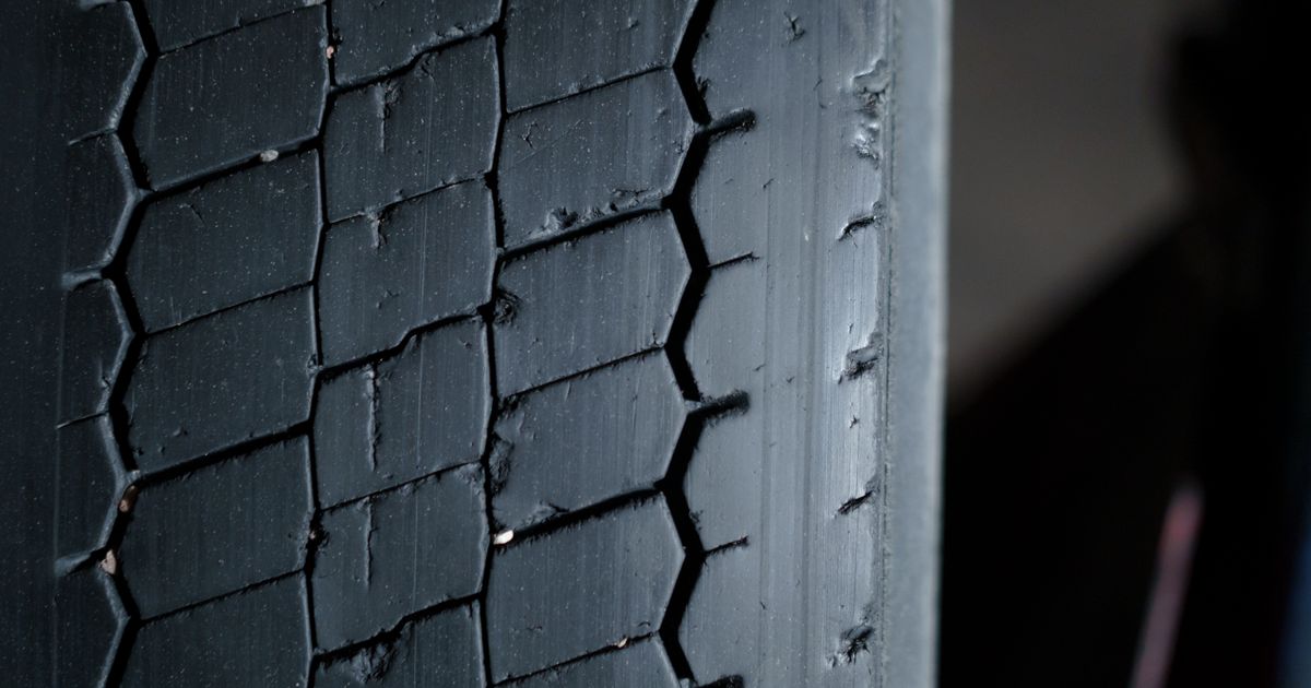 Tyre sidewall close-up showing the speed rating letter at the end of the tyre size code