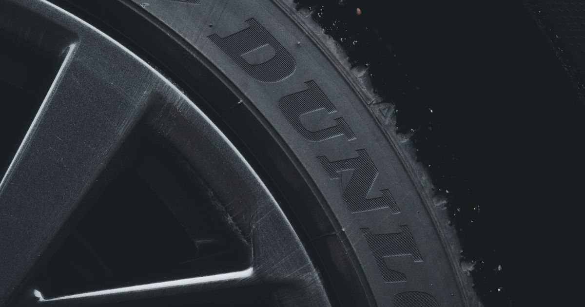 Close-up of a tyre sidewall showing the size markings, load index and speed rating numbers
