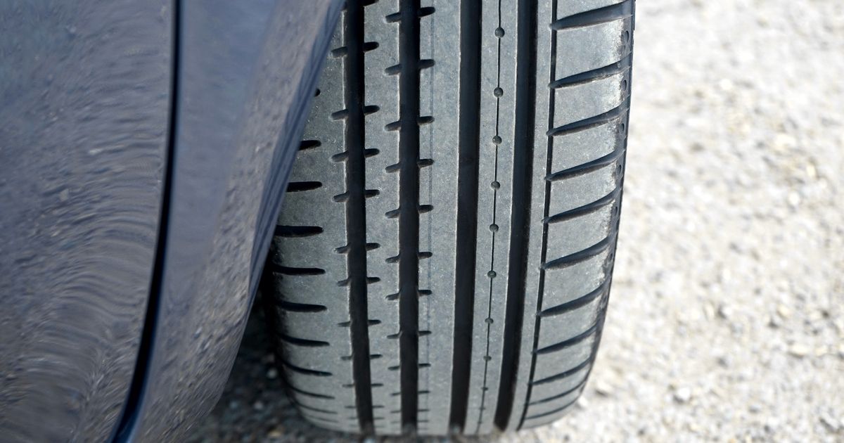 Close-up of a car tyre sidewall showing the size code used to find the right tyre size