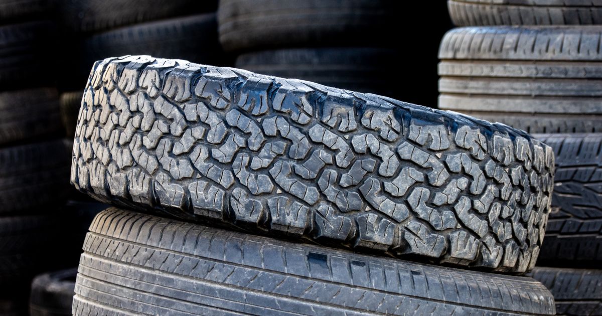 Row of new tyres in a stack, illustrating the best time of year to buy tyres at a good price