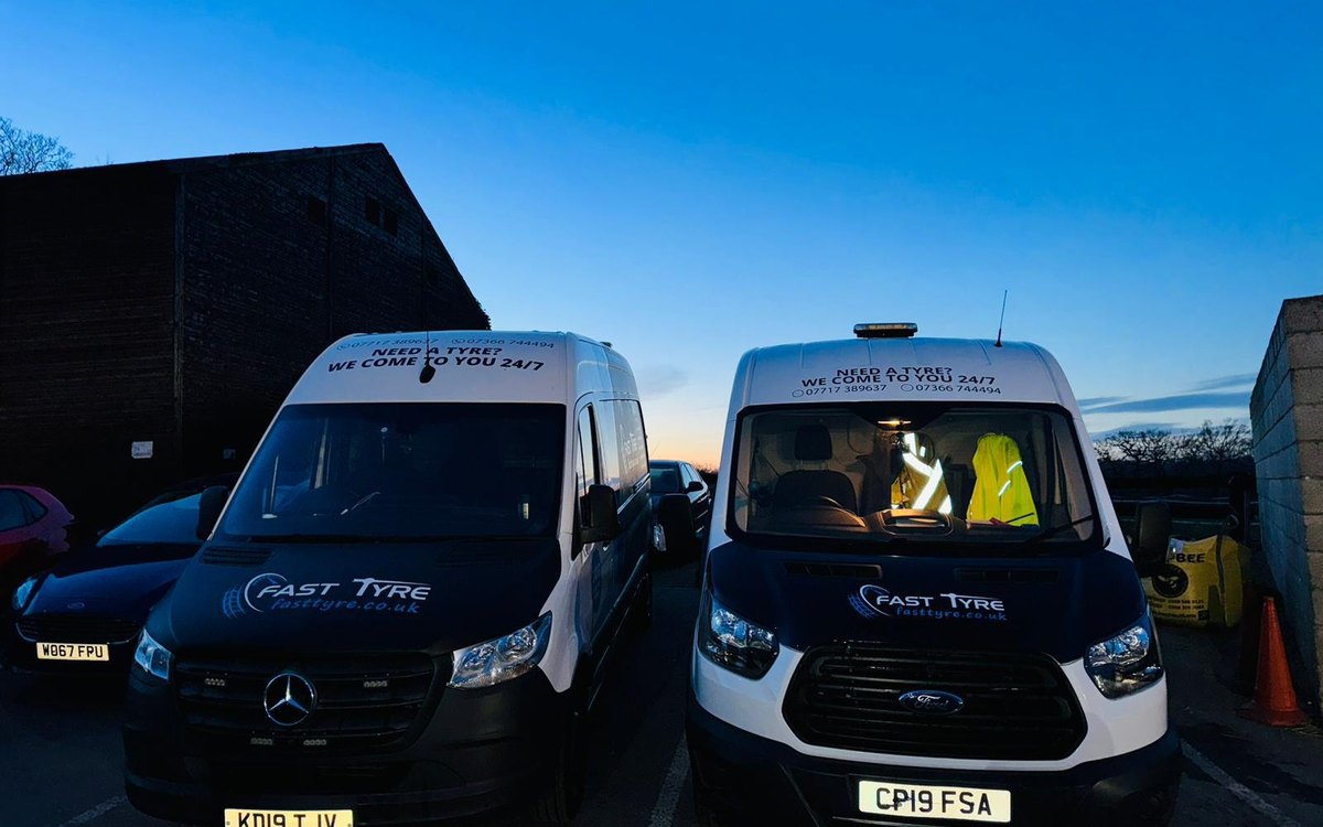 Two Fast Tyre vans at dusk with a fitter in a hi-vis jacket at the wheel, serving Bourne End, Buckinghamshire