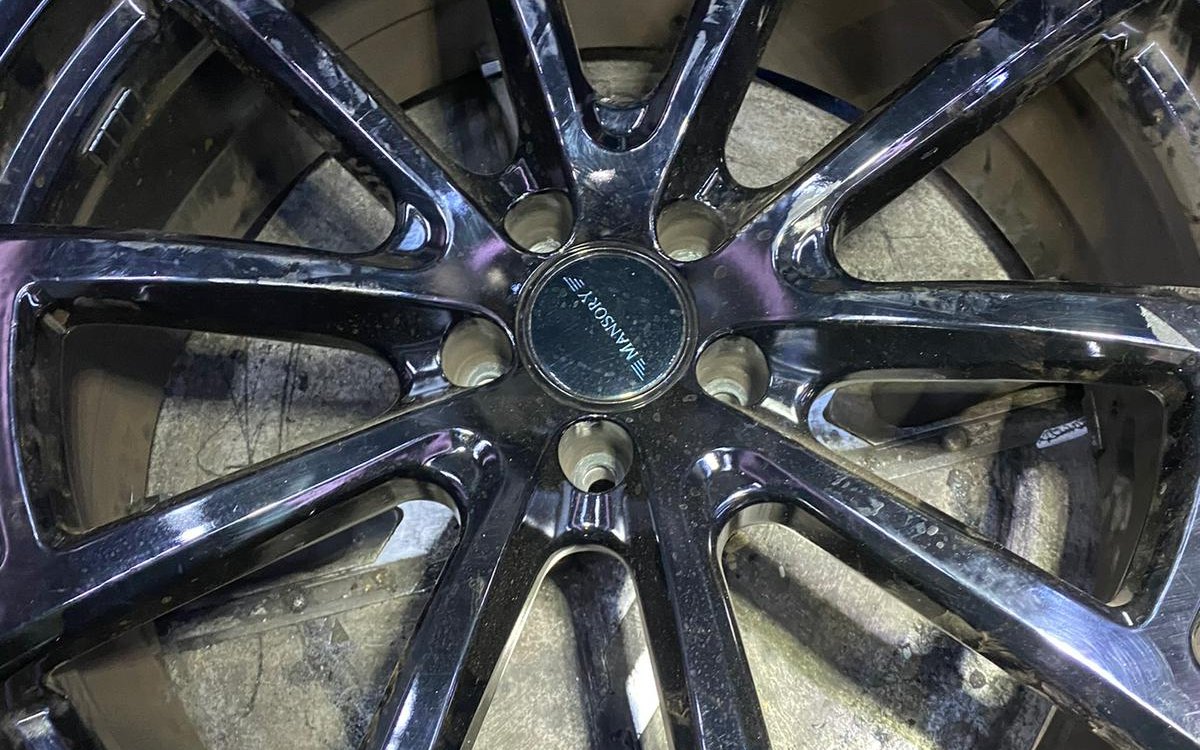 A close-up of a polished multi-spoke alloy wheel