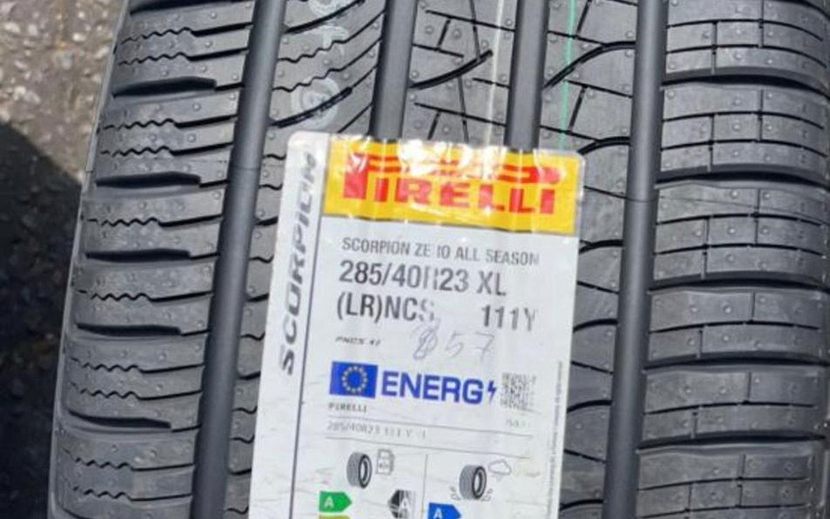A new tyre showing the EU label with its wet grip and noise ratings, on a puncture repair callout in Cobham