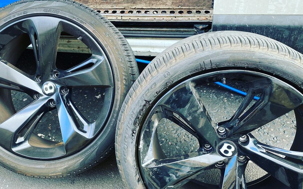 Two large alloy wheels resting on the van ramp, serving Maidenhead, Berkshire