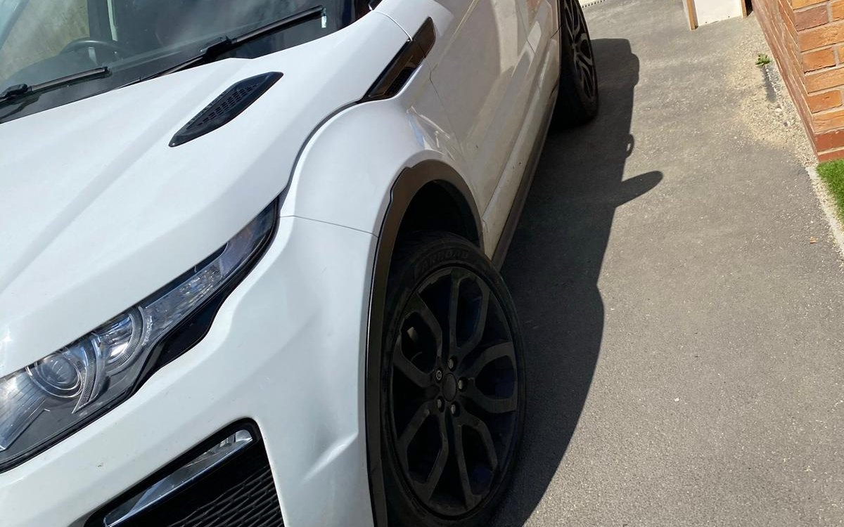 A white Range Rover Evoque on a driveway during a wheel change, serving Broxbourne, Hertfordshire
